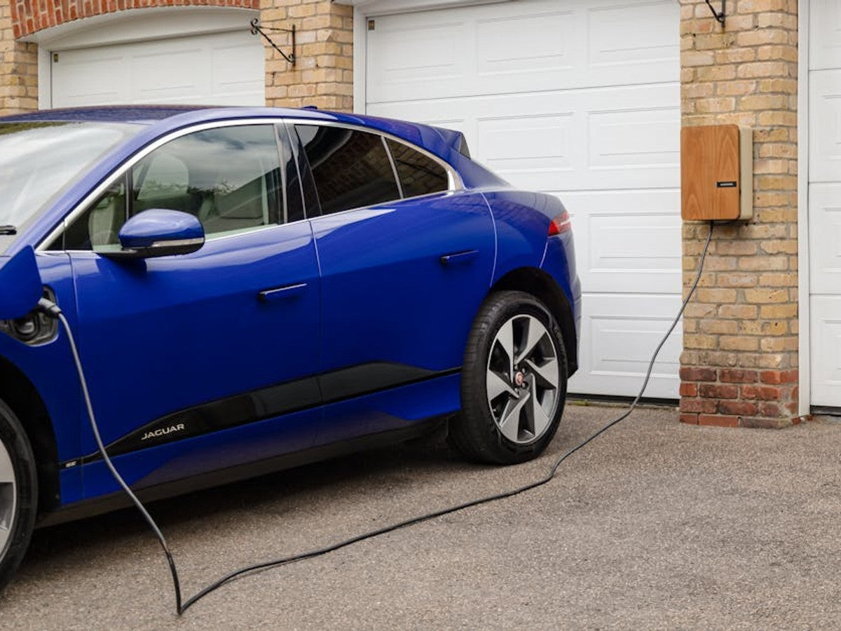 Electric vehicle charging on a stabilised permeable gravel driveway with gravel grid panels